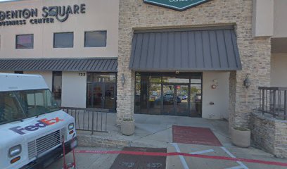 A picture of the outside of a square restaurant.