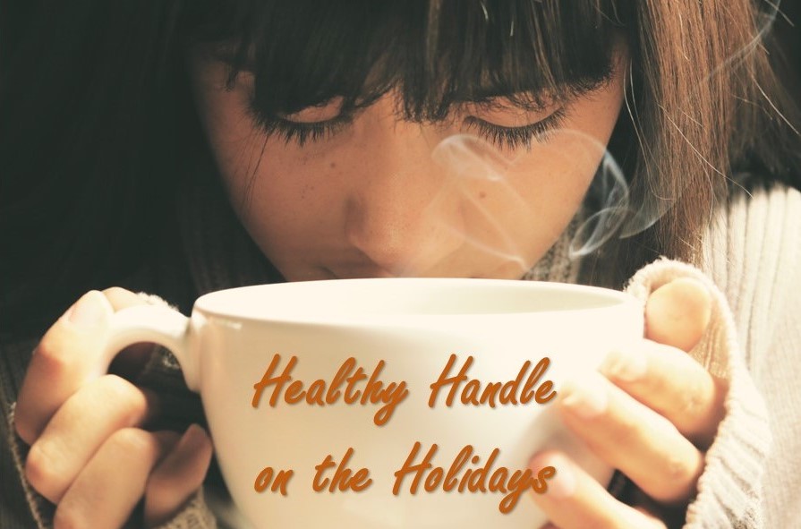 A woman from Love to Live Well holding a coffee cup with the words "healthy handle on the holidays" it.