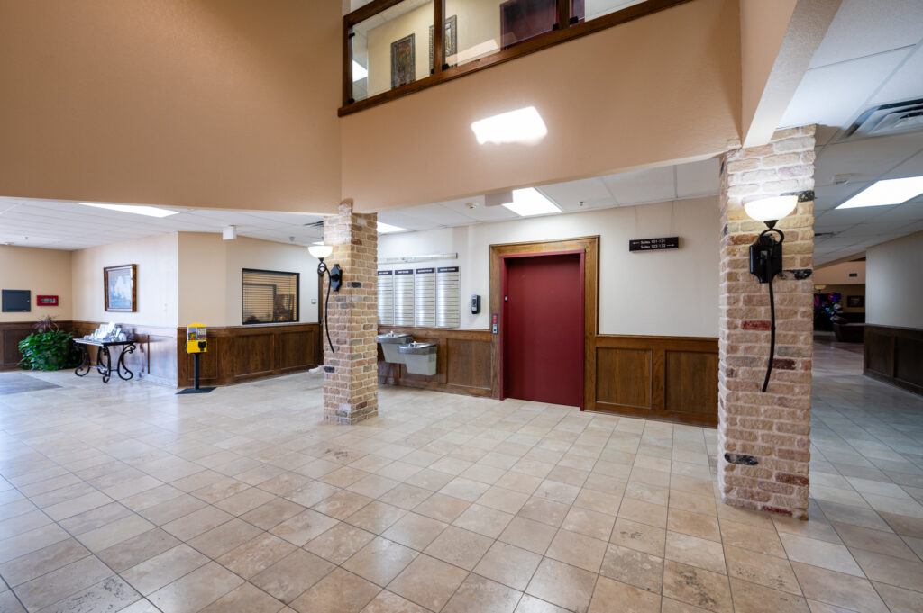 Elevator and directory in lobby.